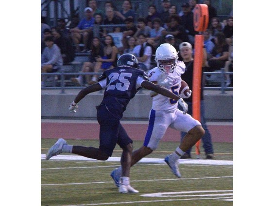 0920-br-hsfootball1.br_ Brantford Collegiate Institute's Deaken Solomon eludes a tackle by Assumption College's Loope Olagunju during AABHN senior football action at Bisons Alumni North Park Sports Complex on Thursday. Brian Smiley Photo by Brian Smiley /Brian Smiley
