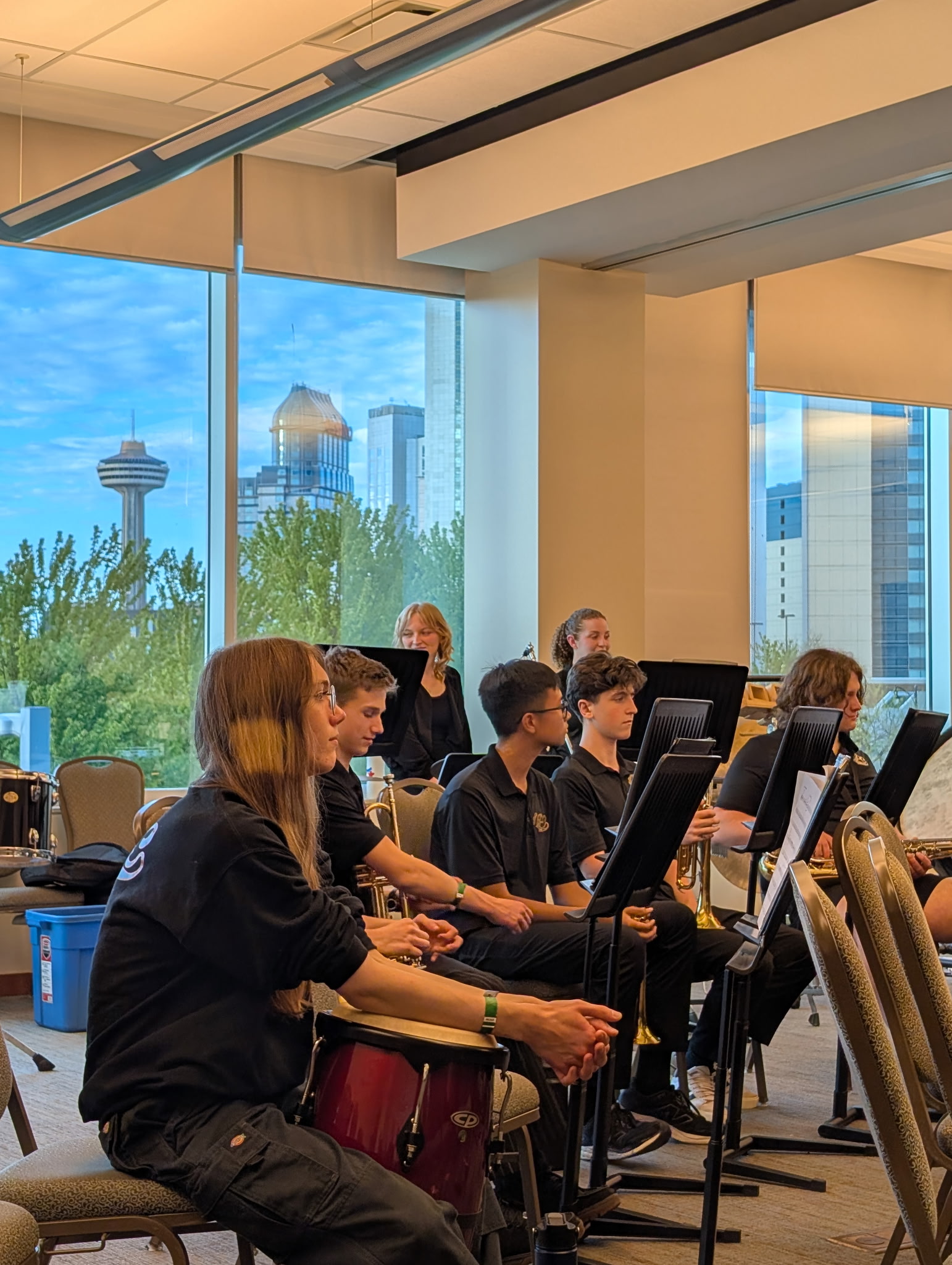 North Park's band sits with their instruments and music sheets
