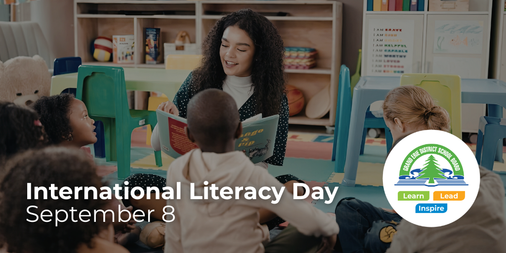 Adult woman reading a book to children on International Literacy Day, September 8