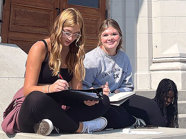 Students doing work outside