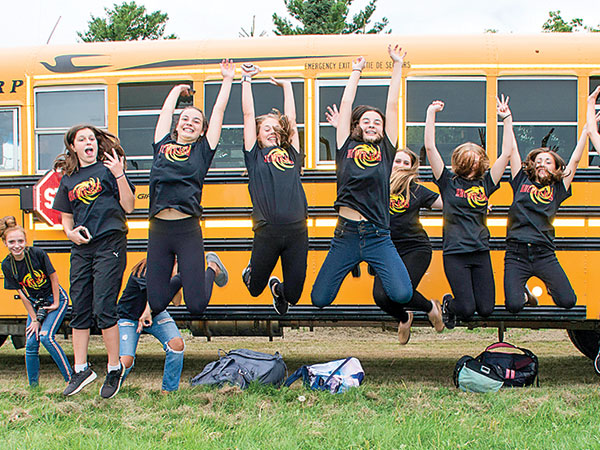 Students Jumping in front of a bus