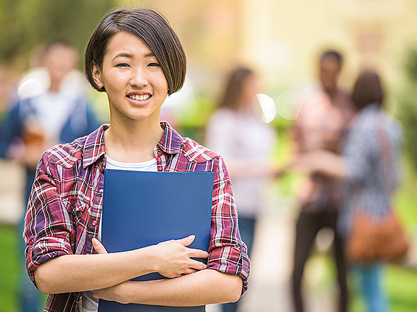 Lady holding school work