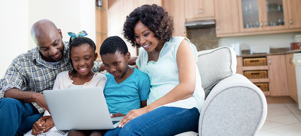 Family sitting on a couch