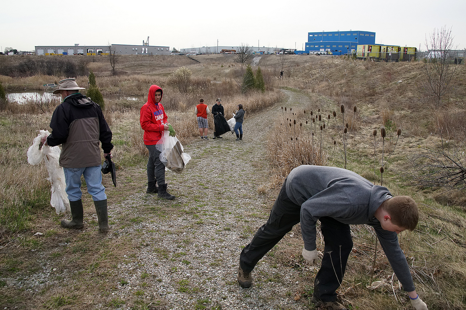 Facilities staff picking up garbage