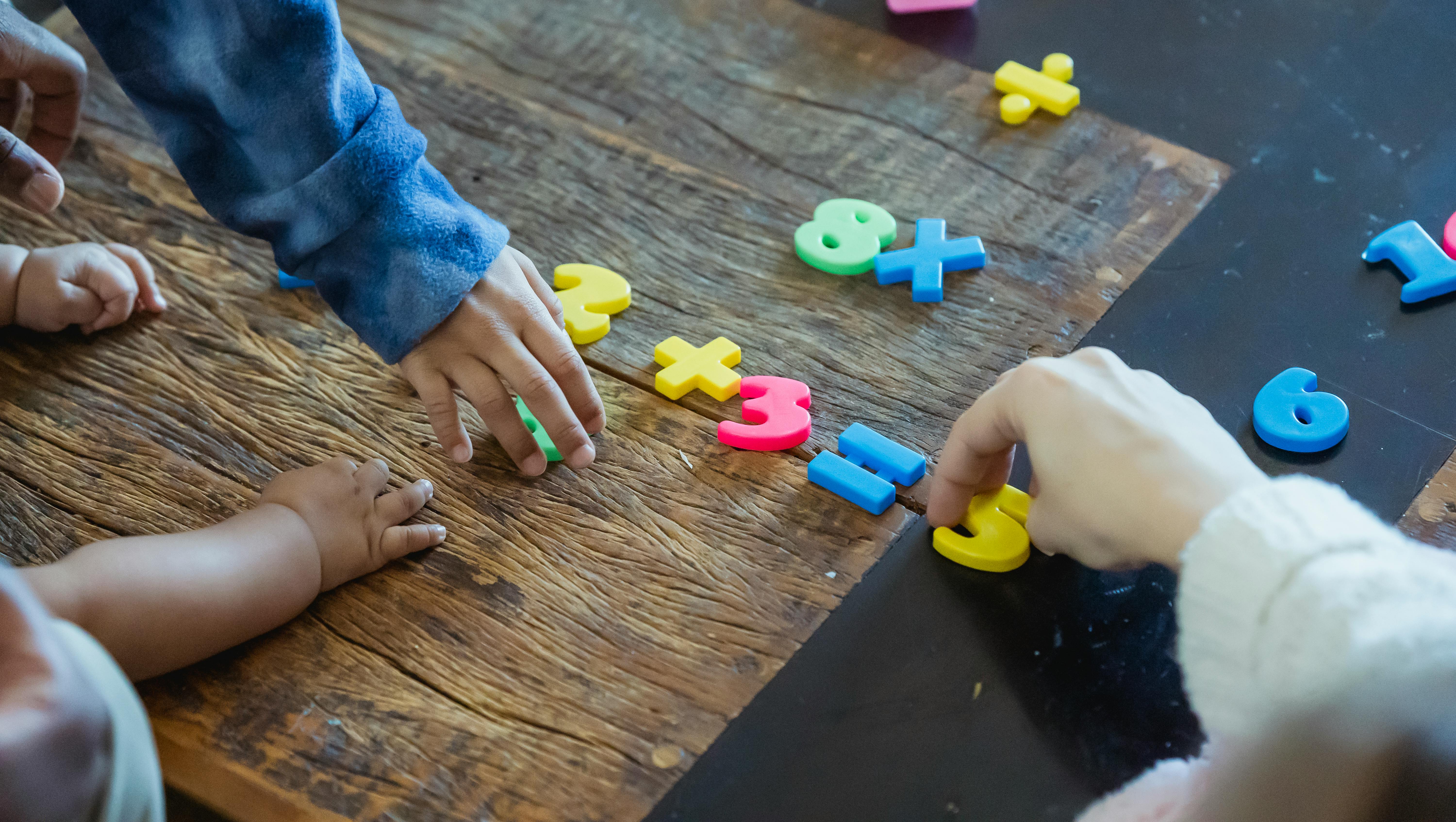 kids playing with numbers on the floor