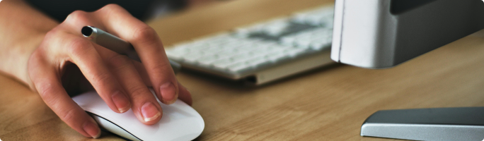 a human hand grabbed a mouse