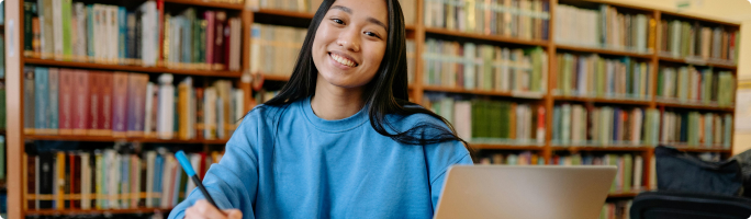 a happy student in a library