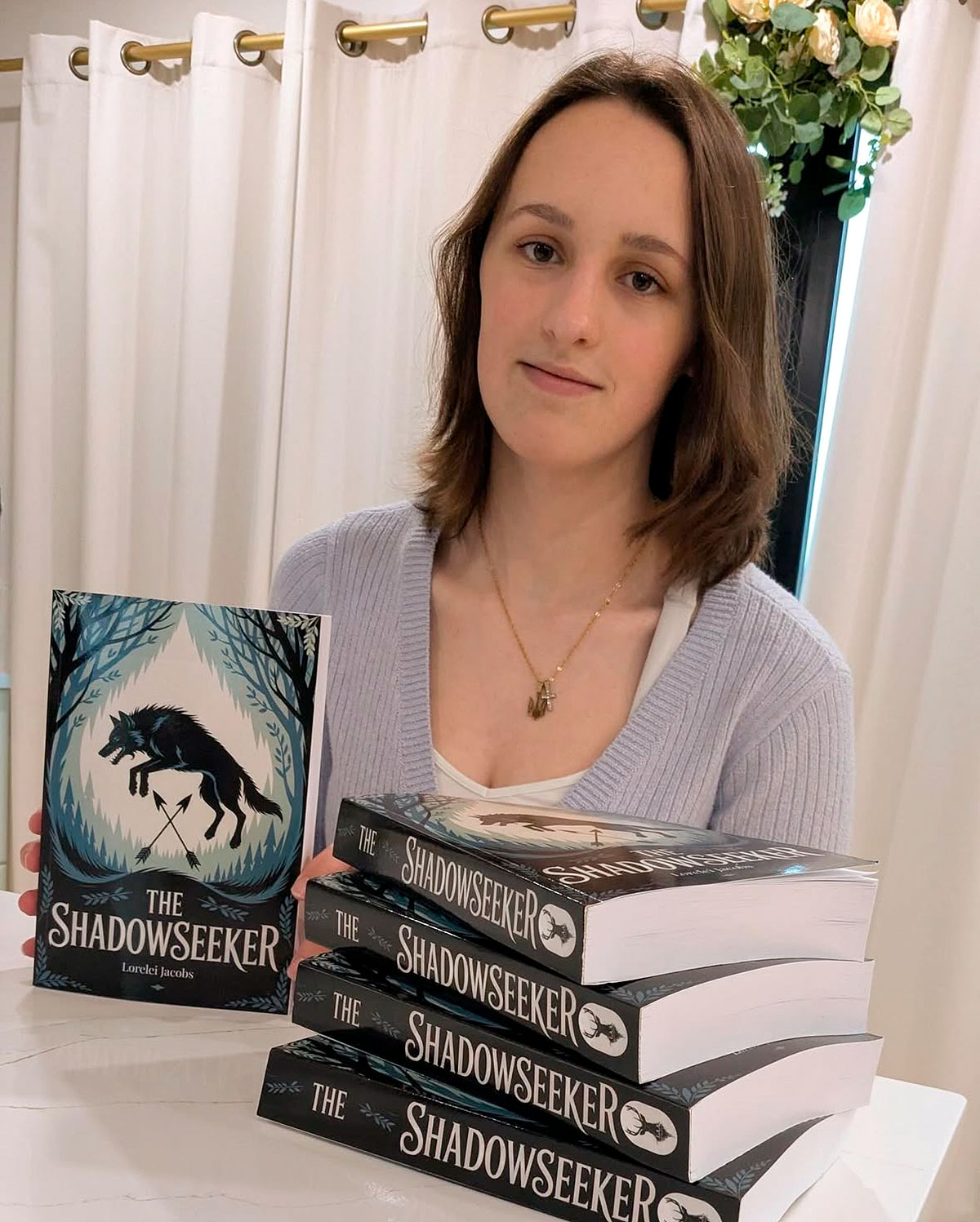 Lorelei Jacobs-Shadowseeker Author Lorelei Jacobs posing with Shadowseeker Book