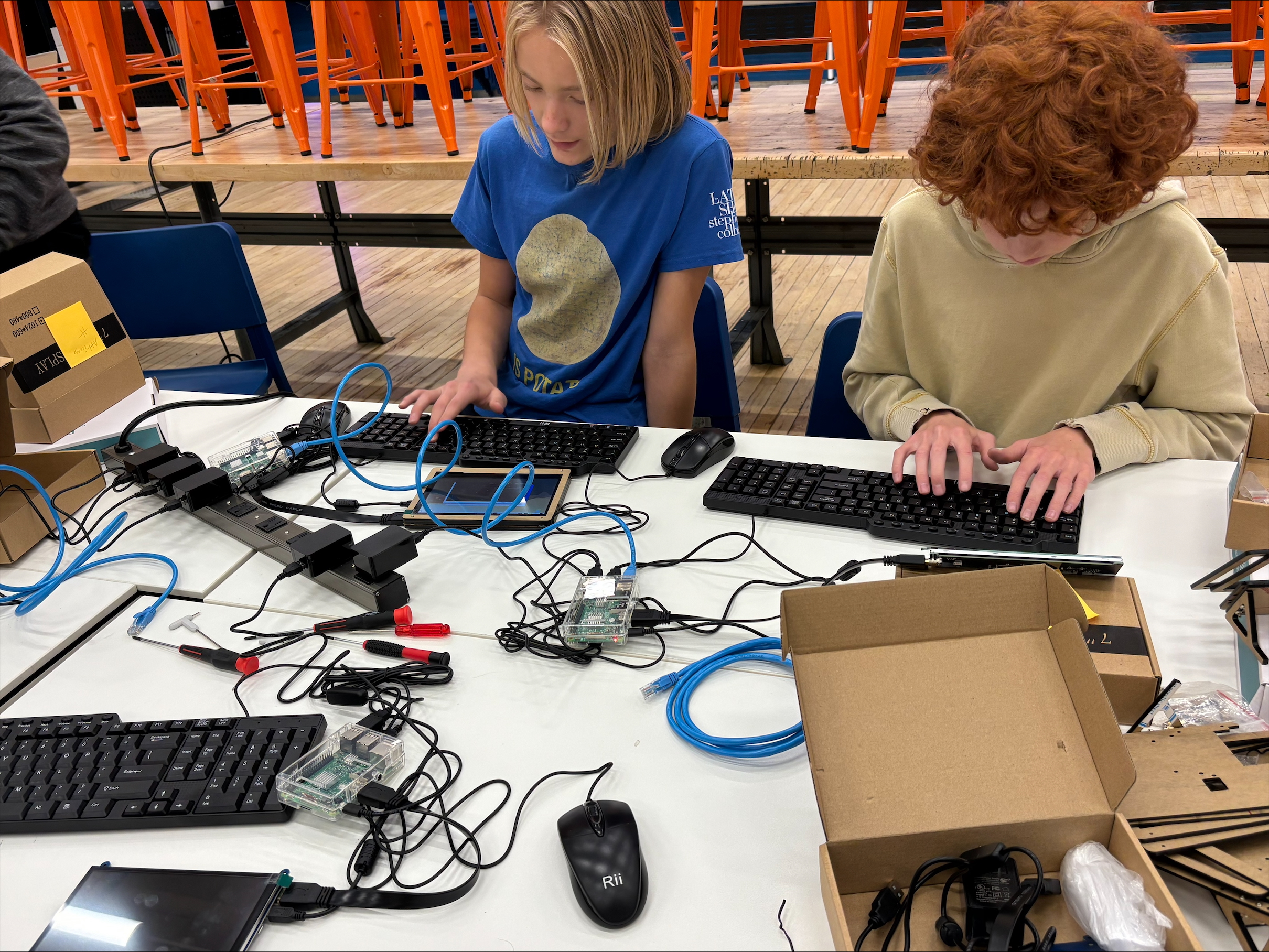 Two students working on cryptography fundamentals (how data is encrypted and decrypted), and practical cybersecurity tools