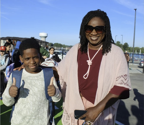 Screenshot 2026-09-08 at 5.55.54 PM Lucy Ruth Ziriro and her son Levi wait outside the new Blanche E. Williams Public School in Brantford where Levi started Grade 6 on September 8.