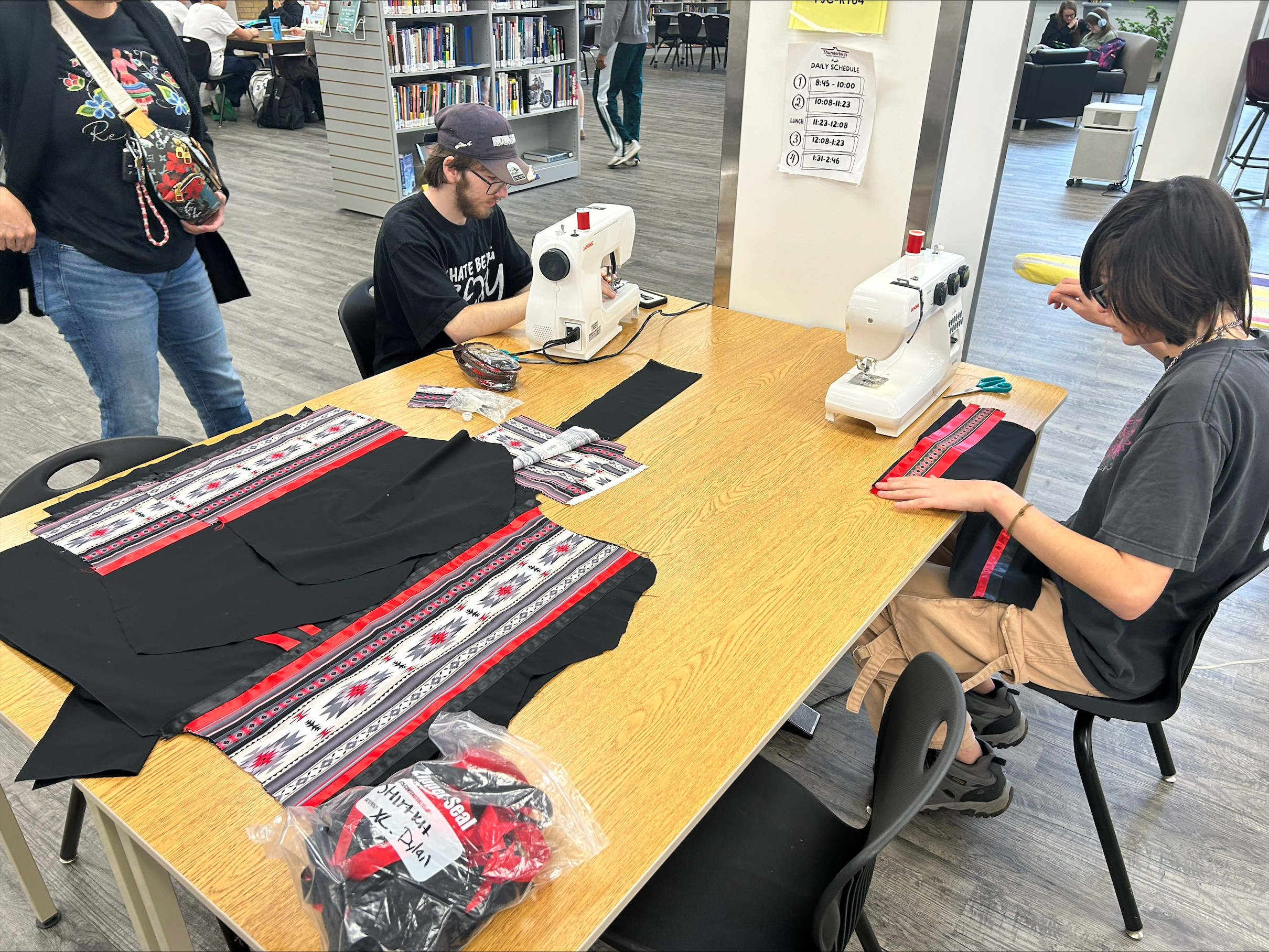 Students sewing cloth