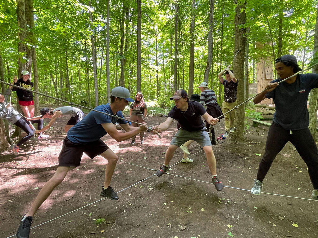 Students playing in the woods