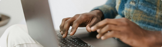 person typing in computer