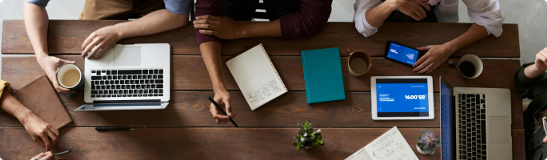 a table with people working