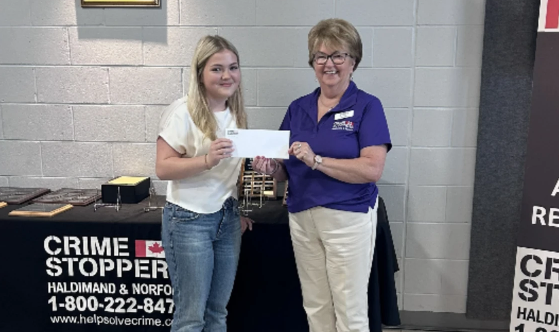 Samantha Nemeth being presented with William Robert Courtnage Community Service Bursary by Lillian Wilson