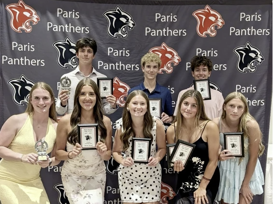 Award winners posing with trophies and plaques